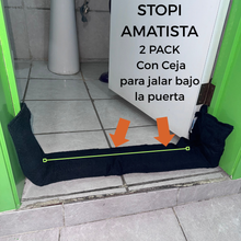 Cargar imagen en el visor de la galería, Stopi Amatista | foto con la ceja indicada por una linea y flechas mostrando que se va a colocar la ceja por debajo de la puerta para atorarlo en esta misma